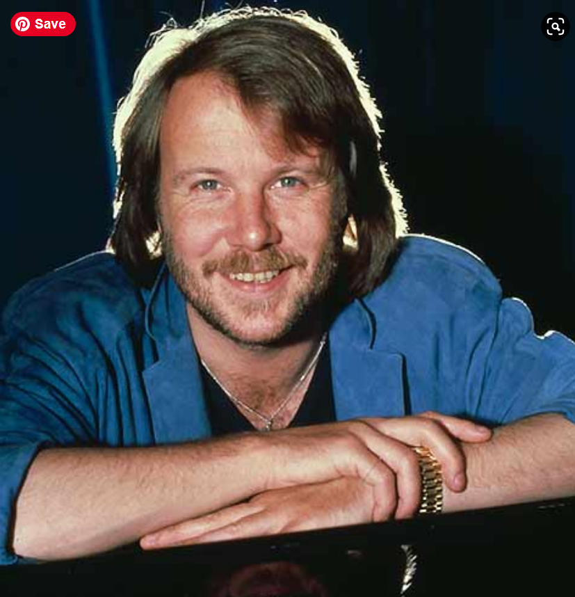 A person with a beard and mustache
Description automatically generated