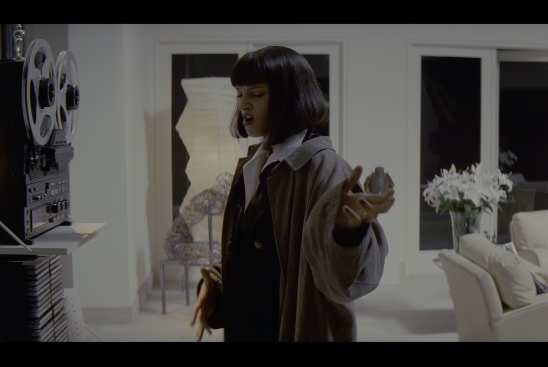 A person in a white room

Description automatically generated