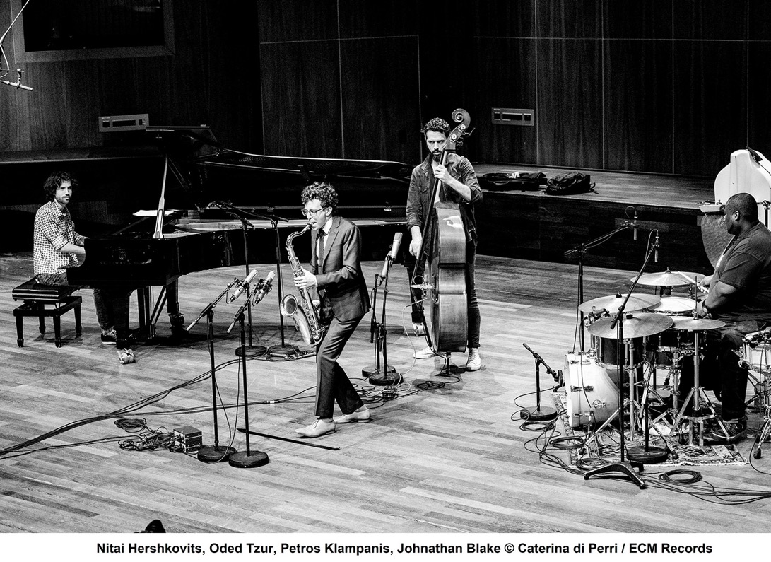 A group of people playing instruments
Description automatically generated