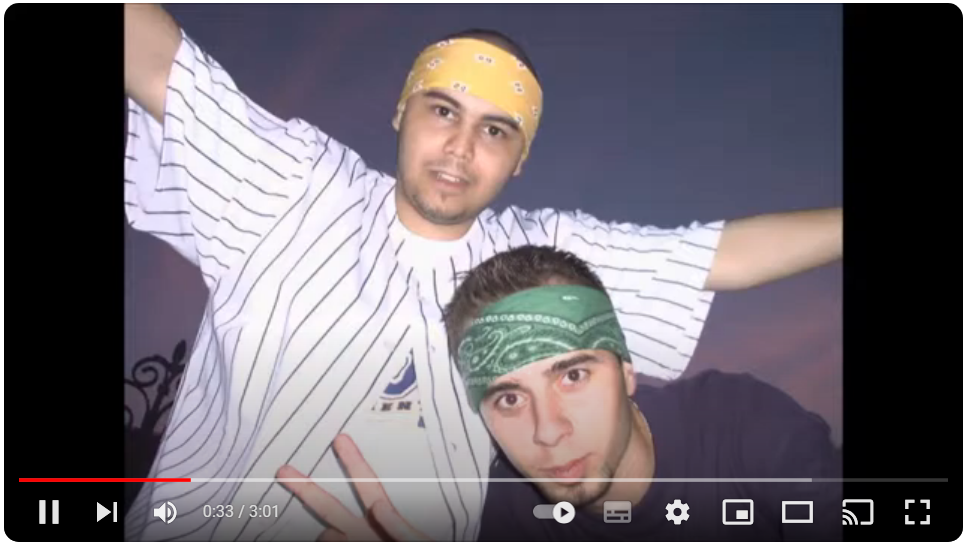 Two men posing for a picture
Description automatically generated