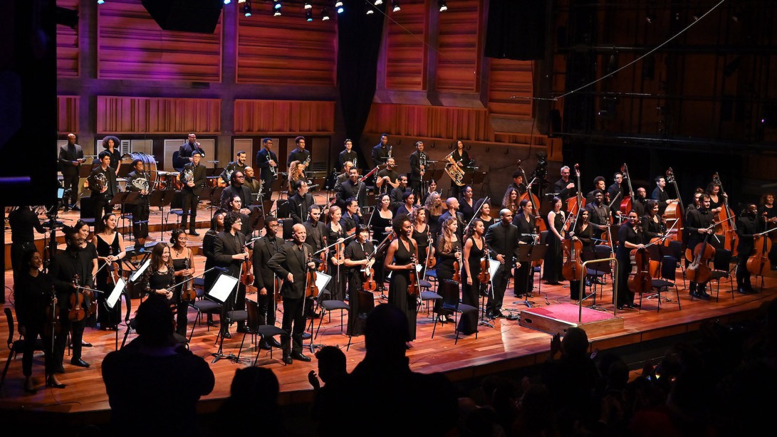 A group of people on a stage

Description automatically generated