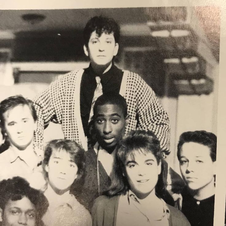 A group of people posing for a photo
Description automatically generated