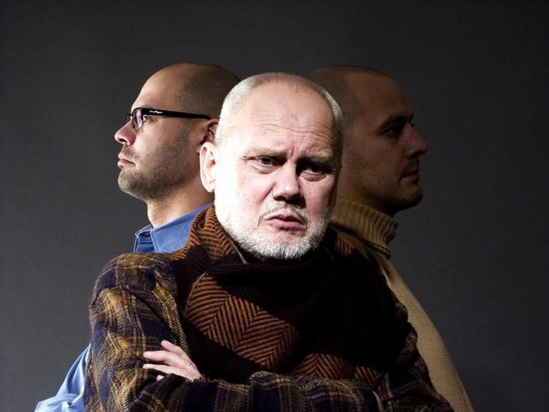 A group of men standing together
Description automatically generated